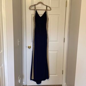 Long midnight blue formal dress. Diamond like sheer sides.
